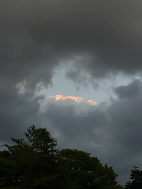 Glimmers of hope peeking through the dramatic storm clouds.